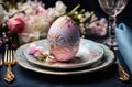easter table setting with paper napkin and egg, pink and blue Royalty Free Stock Photo