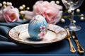 easter table setting with paper napkin and egg, pink and blue Royalty Free Stock Photo