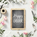 Easter table setting with vintage chalk board, spring flowers and cutlery on light grey background top view flat lay Royalty Free Stock Photo