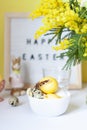 Easter table settings with painted eggs and spring flowers. Royalty Free Stock Photo