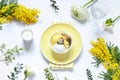 Easter table settings with painted eggs and spring flowers. Royalty Free Stock Photo