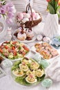 Easter table with stuffed eggs  rolled ham and salad Royalty Free Stock Photo