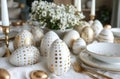 an Easter tablescape full of gold and white eggs on white cloth Royalty Free Stock Photo