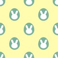 Easter themed seamless pattern: Green easter bunny eggs on yellow packground
