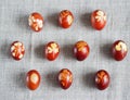 Easter. Traditional onion-peeled eggs on a canvas tablecloth. Arranged in synchronous order. We celebrate the holiday