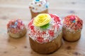 Traditional Russian Easter cake with sugar yellow flower on a wooden table