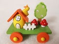 Easter train and egg-house, duckling, mushrooms, a tree in flowers and a white fence - wooden holiday transport toy Royalty Free Stock Photo