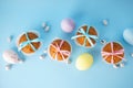 Easter treats, colorful cupcakes on a blue background. Flat lay