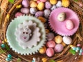 Easter treats, iced cupcakes and Easter eggs, flat lay food photography Royalty Free Stock Photo