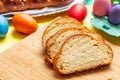 Easter tsoureki braid slices, greek easter sweet bread, on wood Royalty Free Stock Photo