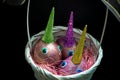 Easter unicorns crafted eggs with toy eyes and colorful shining horns in white basket