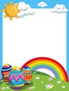 Easter vertical frame decorated eggs rainbow meadow Royalty Free Stock Photo