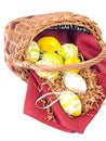 Easter wicker basket with colorful eggs