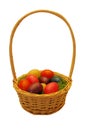 Easter wicker basket with colorful plastic eggs