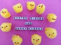 Easter wishes and bunny kisses on a pink background with cute little easter chicks