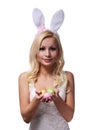 Easter Woman with Bunny Ears holding Colorful Eggs Royalty Free Stock Photo