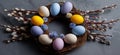 Easter wreath displaying colorful speckled eggs and pussy willow branches. Easter wallpaper. Easter wreath with bright speckled Royalty Free Stock Photo