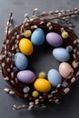 Easter wreath displaying colorful speckled eggs and pussy willow branches. Easter wallpaper. Easter wreath with bright speckled Royalty Free Stock Photo