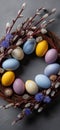 Easter wreath displaying colorful speckled eggs and pussy willow branches. Easter wallpaper. Easter wreath with bright speckled Royalty Free Stock Photo