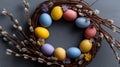Easter wreath displaying colorful speckled eggs and pussy willow branches. Easter wallpaper. Easter wreath with bright speckled Royalty Free Stock Photo