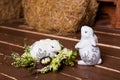 Easter wreath with bunny, flowers and eggs on a wooden background. Royalty Free Stock Photo