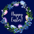 Easter wreath of colored eggs, greenery, blue flowers and willow branches Royalty Free Stock Photo
