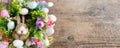 Easter wreath with colorful eggs and flowers and a rabbit in the center Royalty Free Stock Photo