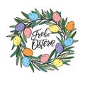 Easter wreath with colororful quail eggs with Happy Easter text lettering in German language.