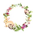 Easter wreath with easter bunny, colored eggs in grass, flowers. Circle border. Watercolor