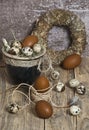 Easter wreath, eggs in a clay pot, brown eggs, quail eggs, chicken feathers, Royalty Free Stock Photo