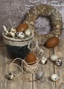 Easter wreath, eggs in a clay pot, brown eggs, quail eggs, chicken feathers, Royalty Free Stock Photo