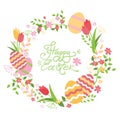 Easter wreath with flowers and eggs. Hand lettering Happy Easter card.