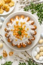 Easter yeast cake babka covered with icing with candied orange peel on a white plate top view. Royalty Free Stock Photo