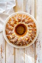 Easter Yeast cake on a white plate on a wooden table, top view Royalty Free Stock Photo