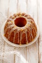 Easter Yeast cake on a white plate on a wooden table, top view. Royalty Free Stock Photo