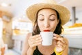 Eastern or asian girl drinking tea or coffee inside a cafe Royalty Free Stock Photo