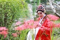 Aisa Chinese woman Peking Beijing Opera Costumes Pavilion garden China traditional role drama play bride dance perform fan Royalty Free Stock Photo