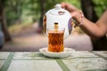 Eastern black tea in glass on a eastern carpet. Eastern tea concept. Armudu traditional cup. Sunset background. Selective focus Royalty Free Stock Photo