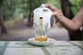 Eastern black tea in glass on a eastern carpet. Eastern tea concept. Armudu traditional cup. Sunset background. Selective focus Royalty Free Stock Photo