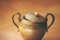 An eastern bowl with patterns, from which smoke comes out and which grants wishes. Ancient artifact Royalty Free Stock Photo