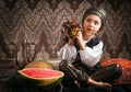 Eastern boy with grape portrait