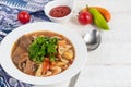 Eastern dish Lagman. Noodles, beef, blue, pepper, tomatoes.