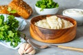 Eastern european dumplings, vareniki with sour cream with parsley Royalty Free Stock Photo