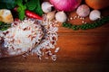 Eastern food spice herb rice garlic chilly pepper mint leaves red onion green pepper on wood table background