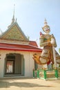 Eastern Gate of The Temple of Dawn with the White Giant Sahatsadecha Guardian Demons Statues, Bangkok, Thailand