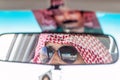 EASTERN JORDAN - APRIL 3, 2017: Local arab driver reflecting in a mirror of his ca