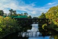 Eastern Maine Railroad crossing bridge over river on an early fall evening Royalty Free Stock Photo