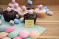 Homemade cakes with egg decorations with happy Easter words