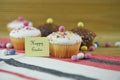 Happy Easter words with homemade cakes and Easter egg decorations