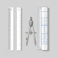 Easurement markings a metal compass for drawing circles and a rolled blueprint Royalty Free Stock Photo
